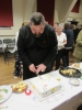 Father Jim cutting the cake